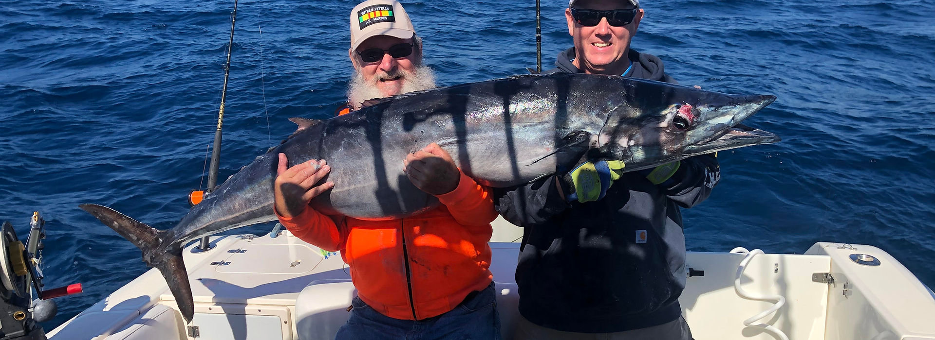 Anglers with their catch aboard One More Cast Fishing Adventures